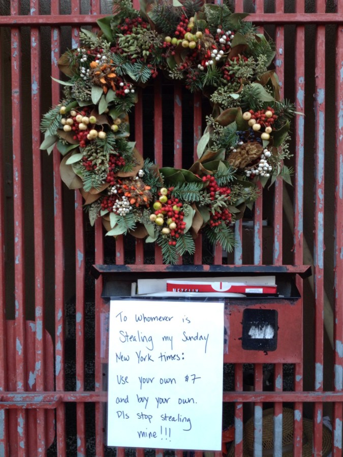 "Buy your own paper" sign