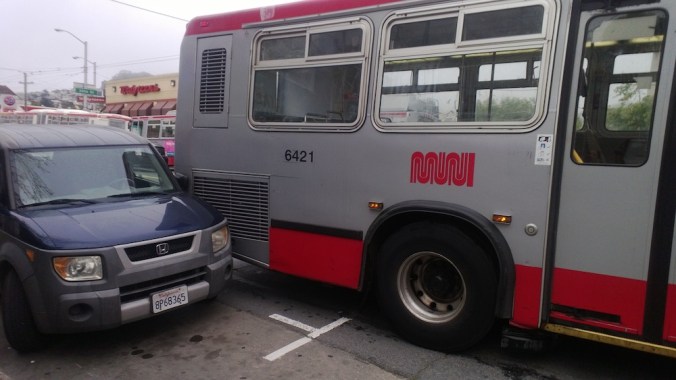Muni backs up into my neighbor's car in slow mo as he yells, "stop, hey! What the hell are you doing!"  @bernalwood